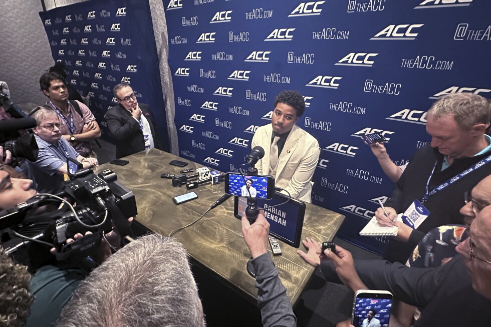 Miami quarterback Darian Mensah listens to reporters during the 2026 ACC Football Kickoff in Charlotte